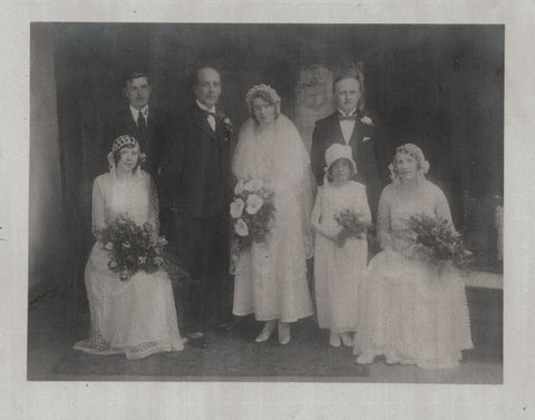 Old photograph of wedding party with bride and groom