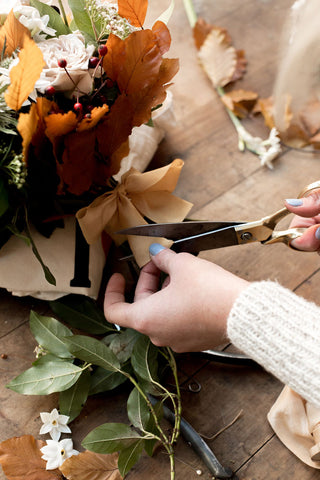 Hand cuttin gold tones silk ribbon on a flower bouquet