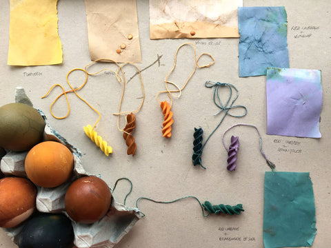Naturally dyed Easter eggs, coloured pasta and plant dyed pieces of paper