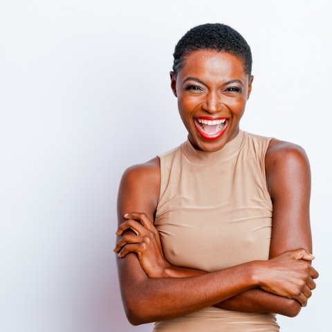 Beautiful black woman with short cropped hair L'opera Lipstick on her lips and Mossy Sensation and Inky eye shadows with pitchblack eye liner