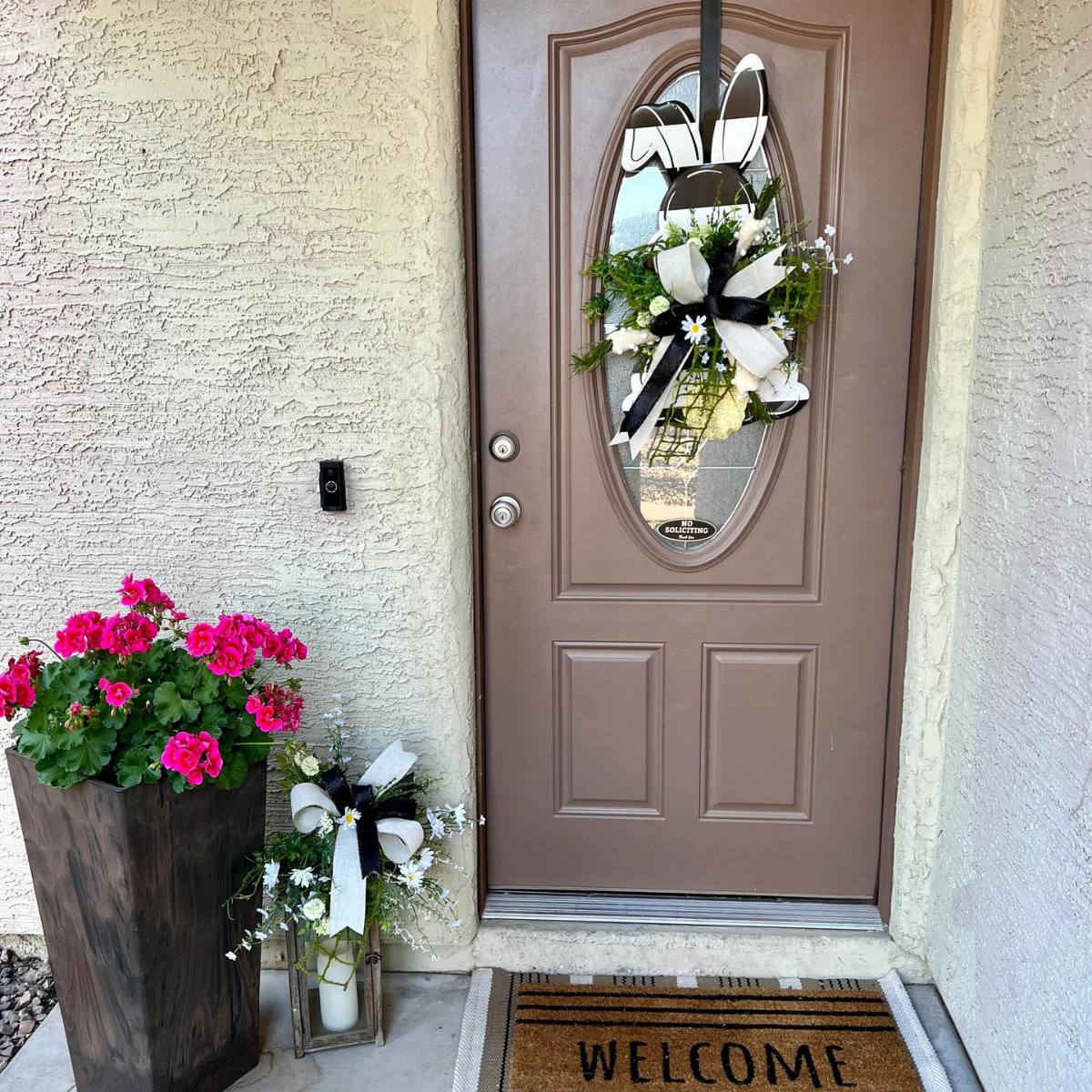 big bunny door hanger on front door and coordinating lantern topper