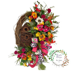 birdhouse grapevine wreath with beautiful blooms