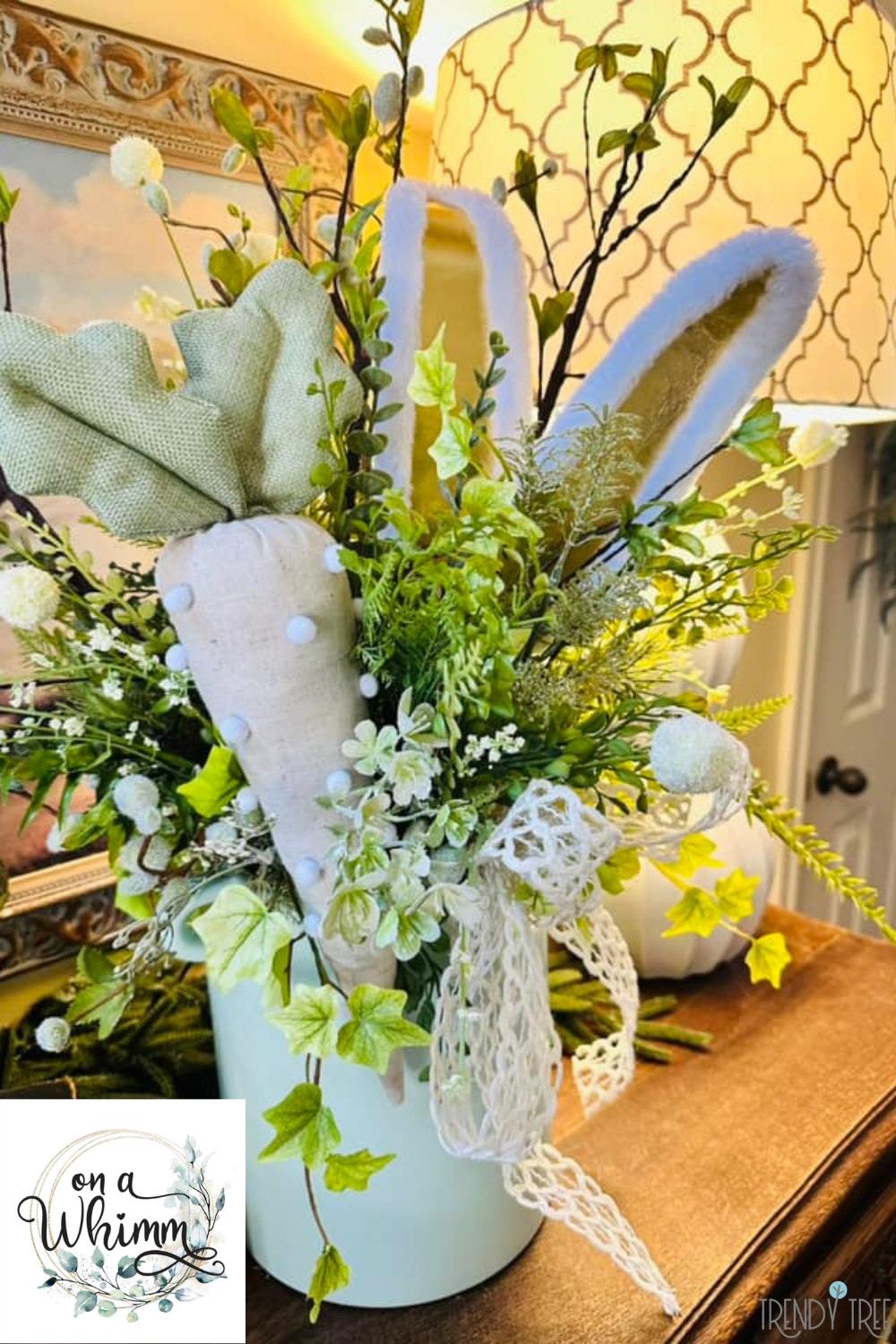 spring and easter floral arrangement using plush bunny ears and fabric carrot