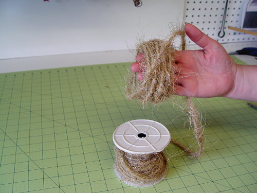 fishing-wreath-jute-ribbon-curled-around-hand