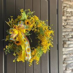 repurposed grapevine wreath with yellow forsythia