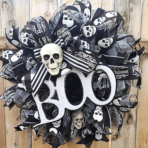 black white halloween wreath with skulls and boo sign