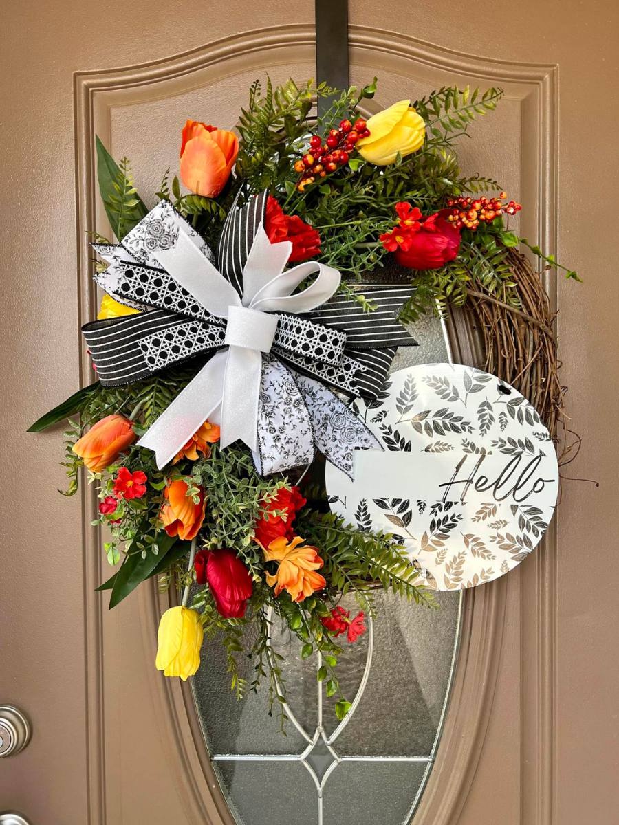 floral grapevine wreath with hello sign