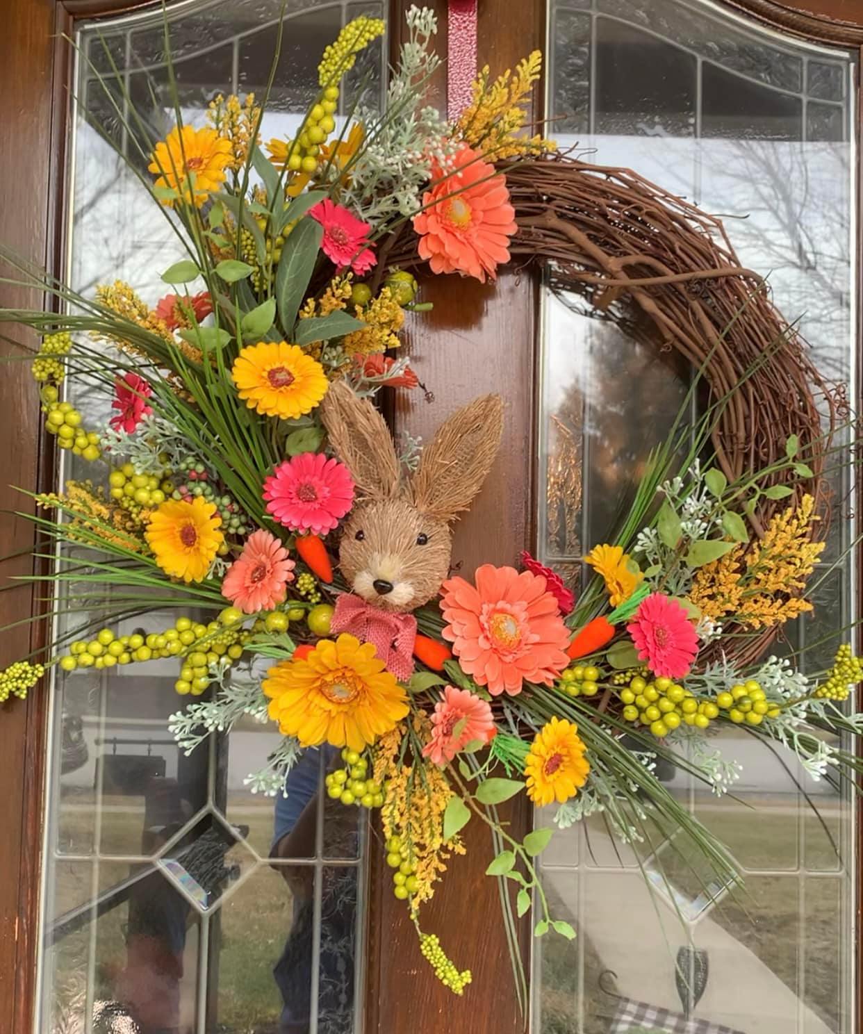 grapevine wreath with blooms and grass bunny