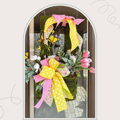 mossy wall basket with spring tulips, ranunculus and butterflies