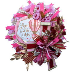 valentine wreath with sign love is in the air