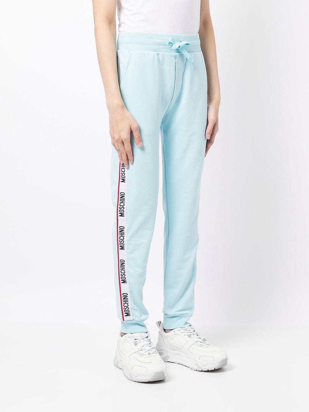 Shop Moschino Logo Tracksuit Bottoms