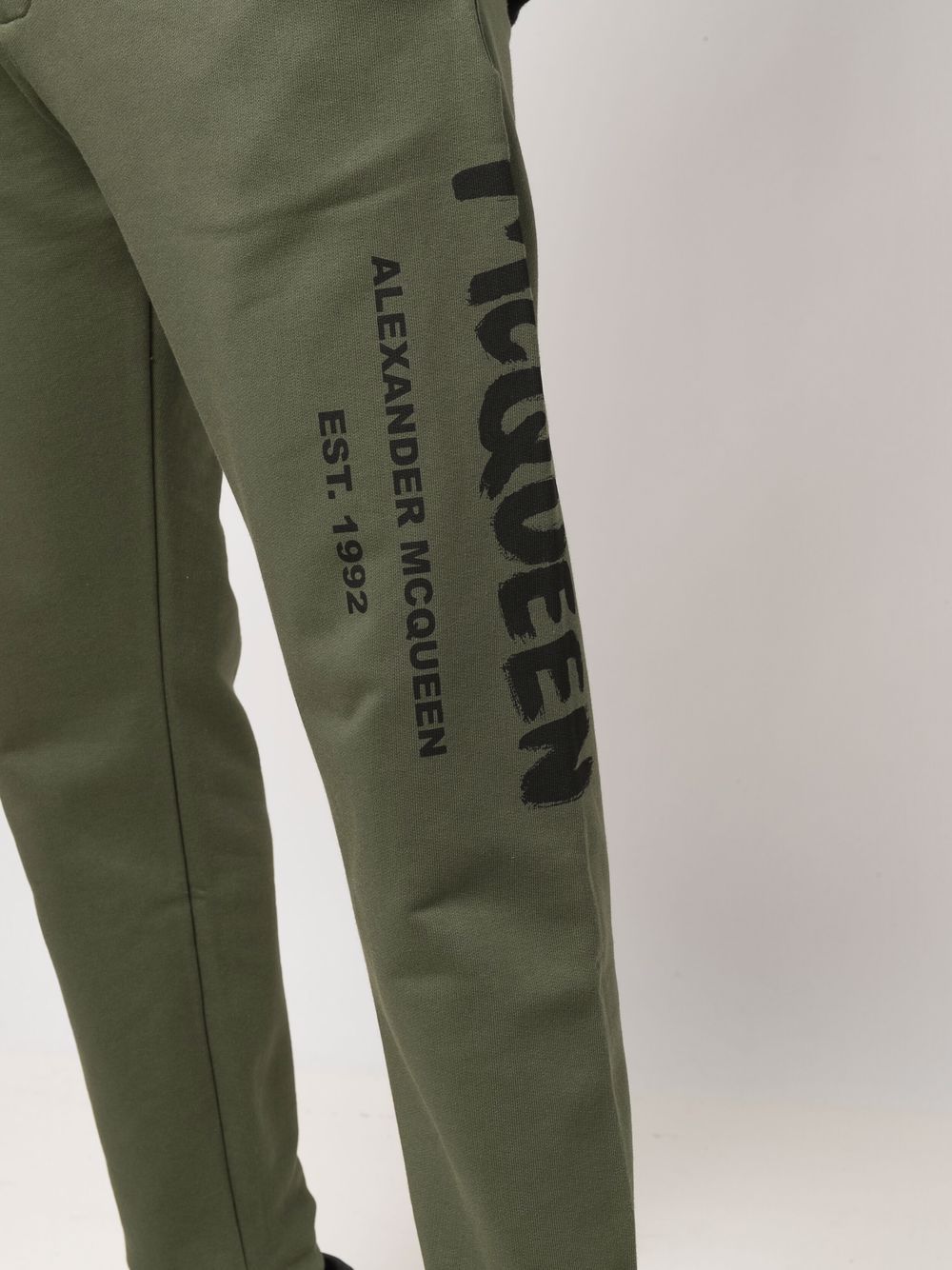 Shop Alexander Mcqueen Logo Print Tapered Track Trousers