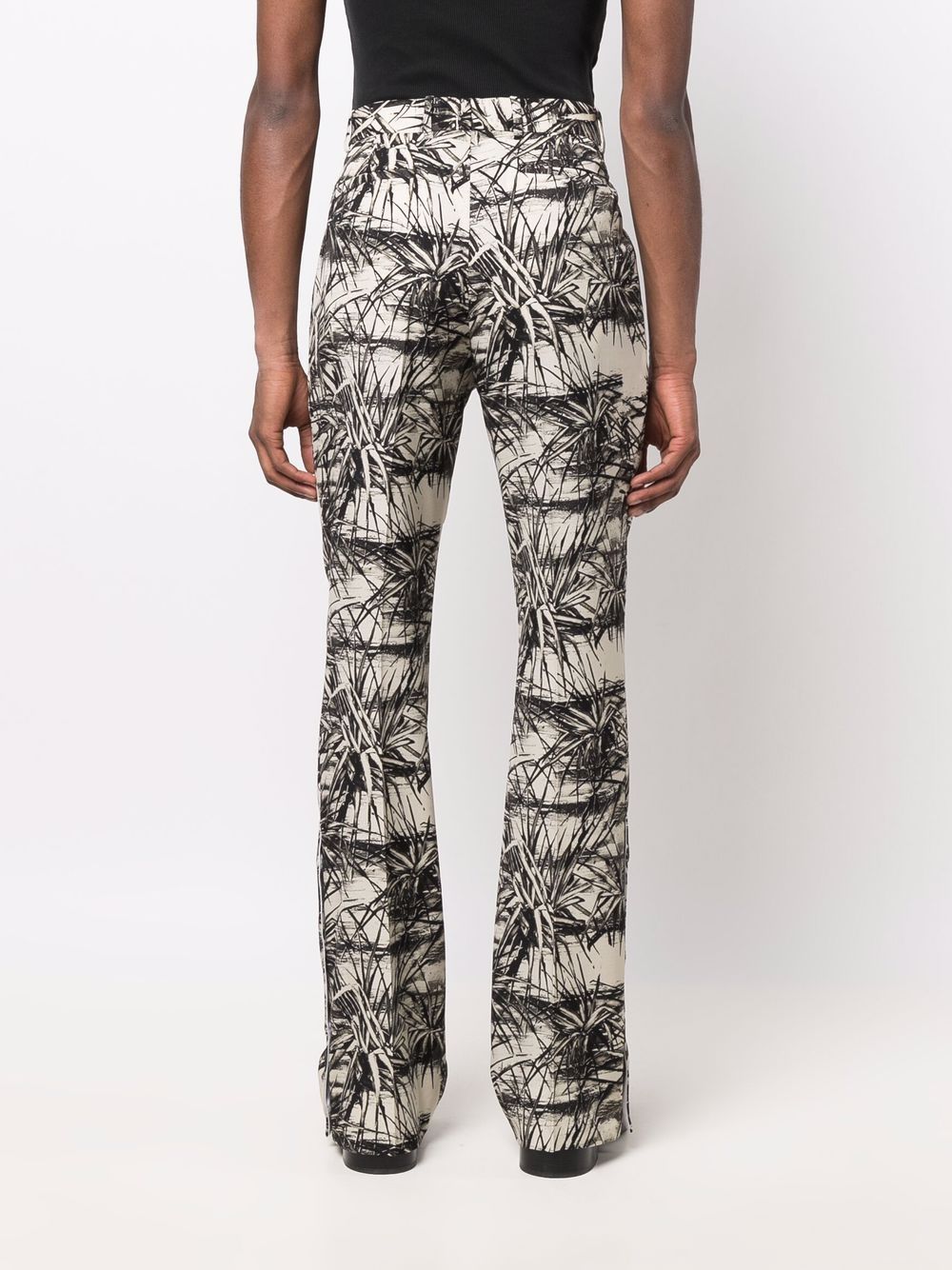 Shop Amiri Graphic-print Flared Trousers