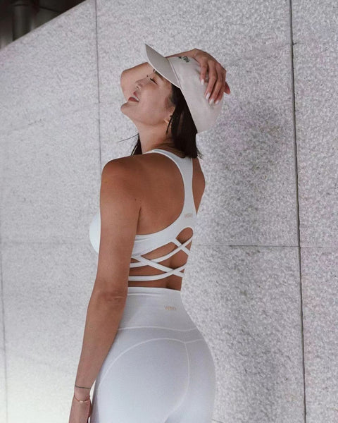 A model wearing a pure white WISKII activewear set.