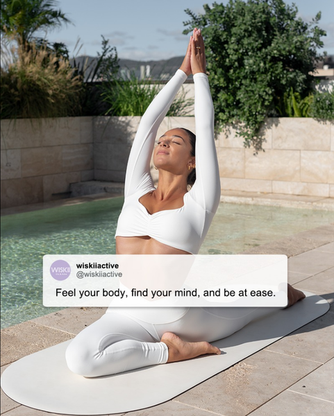 Girls are relaxing doing yoga by the pool