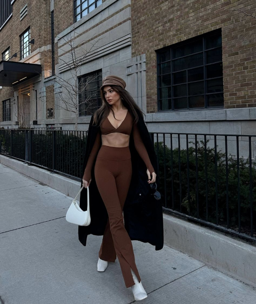 Model shows off stylish slim fit sportswear on the street