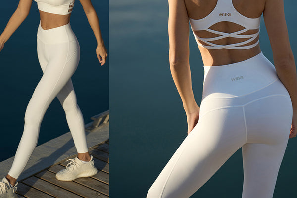 A model showcasing a white workout outfit.