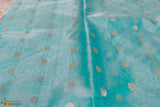A diligently hand woven 100% Chanderi silk saree from Madhya Pradesh.   This beautiful fusion of sky blue and blooming red colour has been handwoven by the artisans of the Chanderi community. The saree is heavy in design yet extremely light in nature. The colours complement each other so well that they create an impact at first sight. This saree is best paired with a bold red lip. 