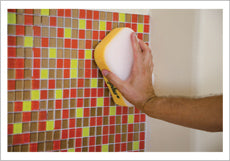DIY Backsplash: Cleaning the grout excess 