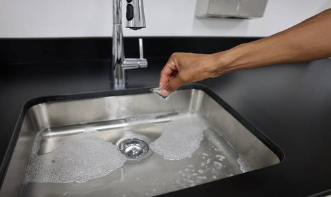 dissolving detergent pod in sink