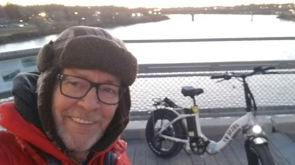 A man and his eBike over a river in Saskatchewan