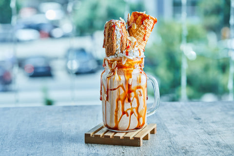 https://cdn.shopify.com/s/files/1/0268/4508/5731/files/caramel-ring-milkshake-wooden-plate-marble-table_480x480.jpg?v=1617909724