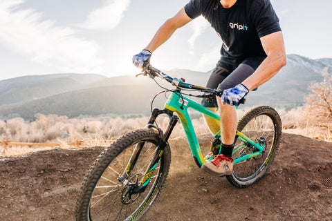 Mountain bike rider with sunset background in Utah