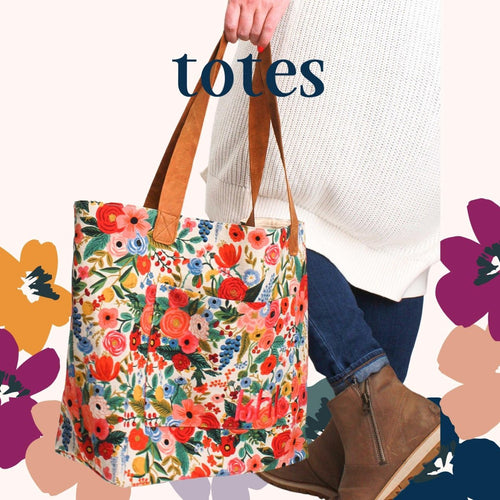 Everyday Tote – Large Floral Tote Bag by Modern Makerie Woman holding Modern Makerie Everyday Tote in Wildflower Canvas print