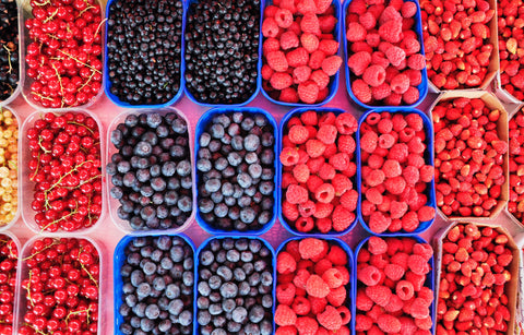 blueberries and raspberries in a box
