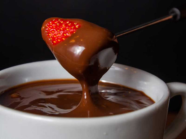 Chocolate fondue with dairy free chocolate buttons.