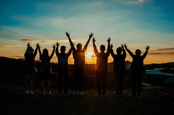 Silhouette of friends - enjoy dairy free chocolate buttons.