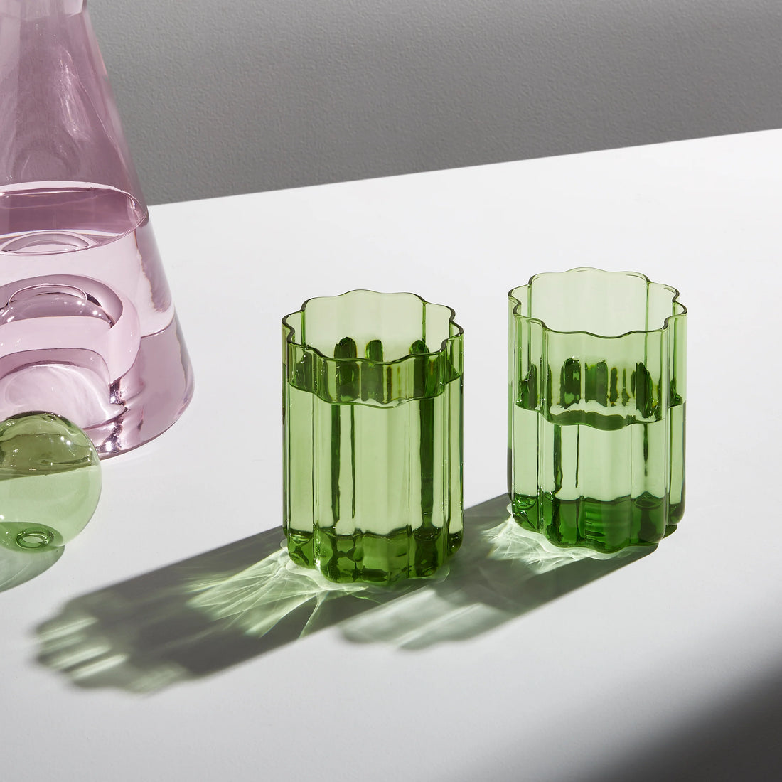 https://cdn.shopify.com/s/files/1/0268/7782/1041/products/fazeek-wave-glass-set-green-set-of-2-pollyncoau_3.webp?v=1680574570&width=1100