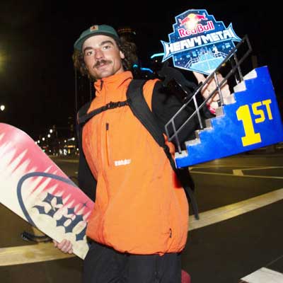 Photo of Pro Snowboarder holding his Red Bull Heavy Metal Trophy