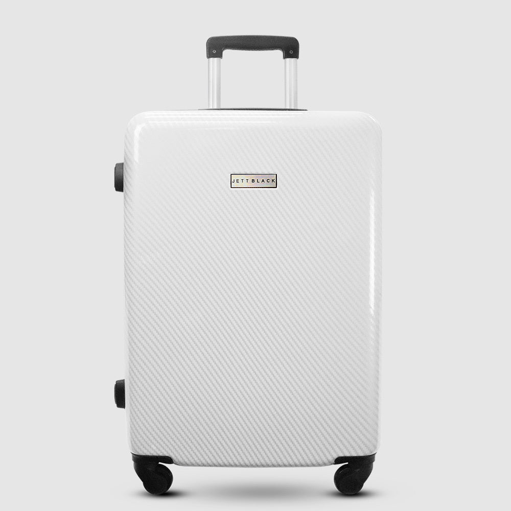 white hard shell luggage