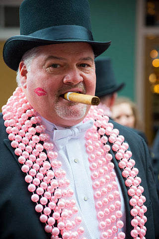 Man In Black Suit And Beads Styled For Mardi Gras