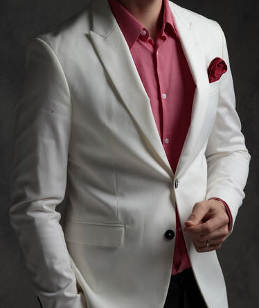 White Suit With Peak Lapels And A Pink Undershirt