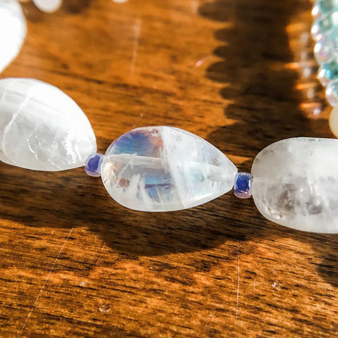 A close-up of a bead on our Rainbow Petals bracelet.