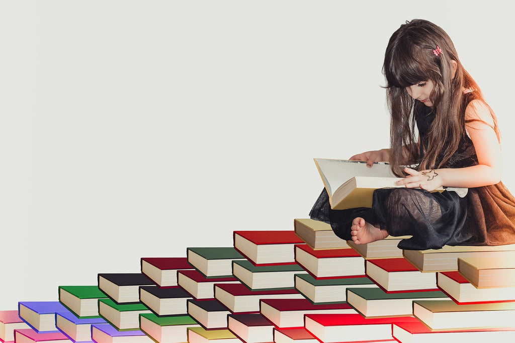 A young girl sits atop a colorful staircase of books, immersed in reading, symbolizing the joy and elevation that reading brings to the young mind.