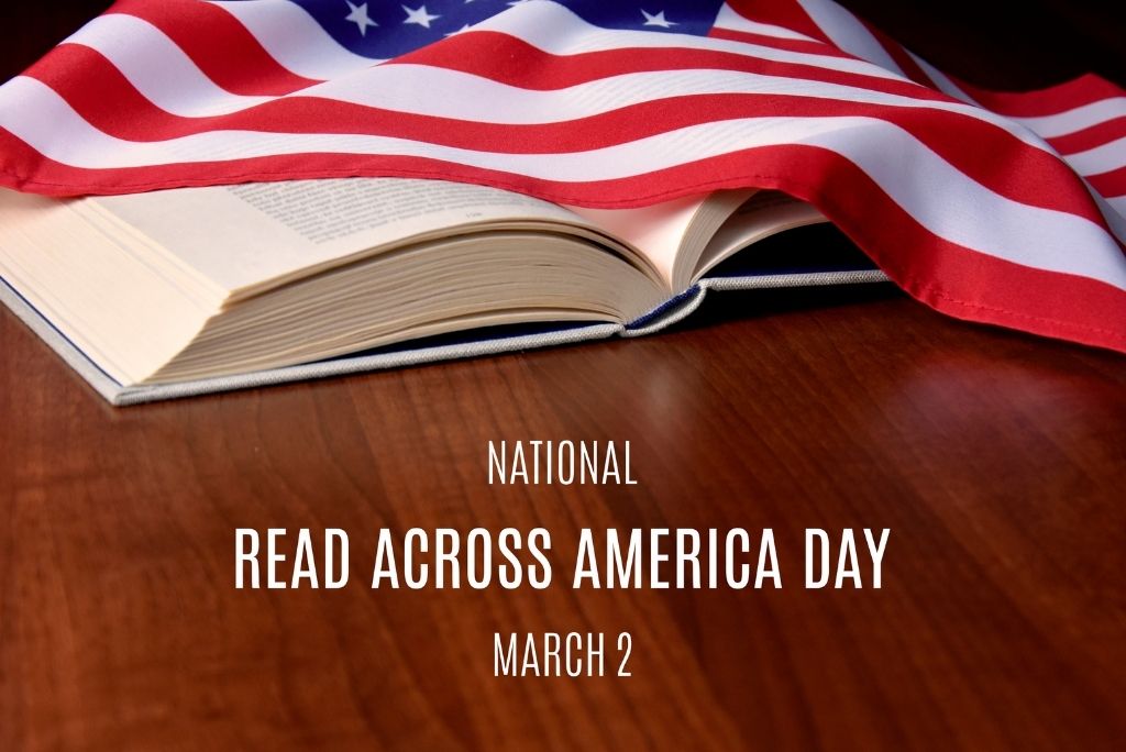 Open book with an American flag draped over it, symbolizing National Read Across America Day.