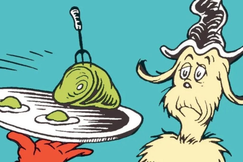 A whimsical character looking skeptically at a plate of green eggs and ham.