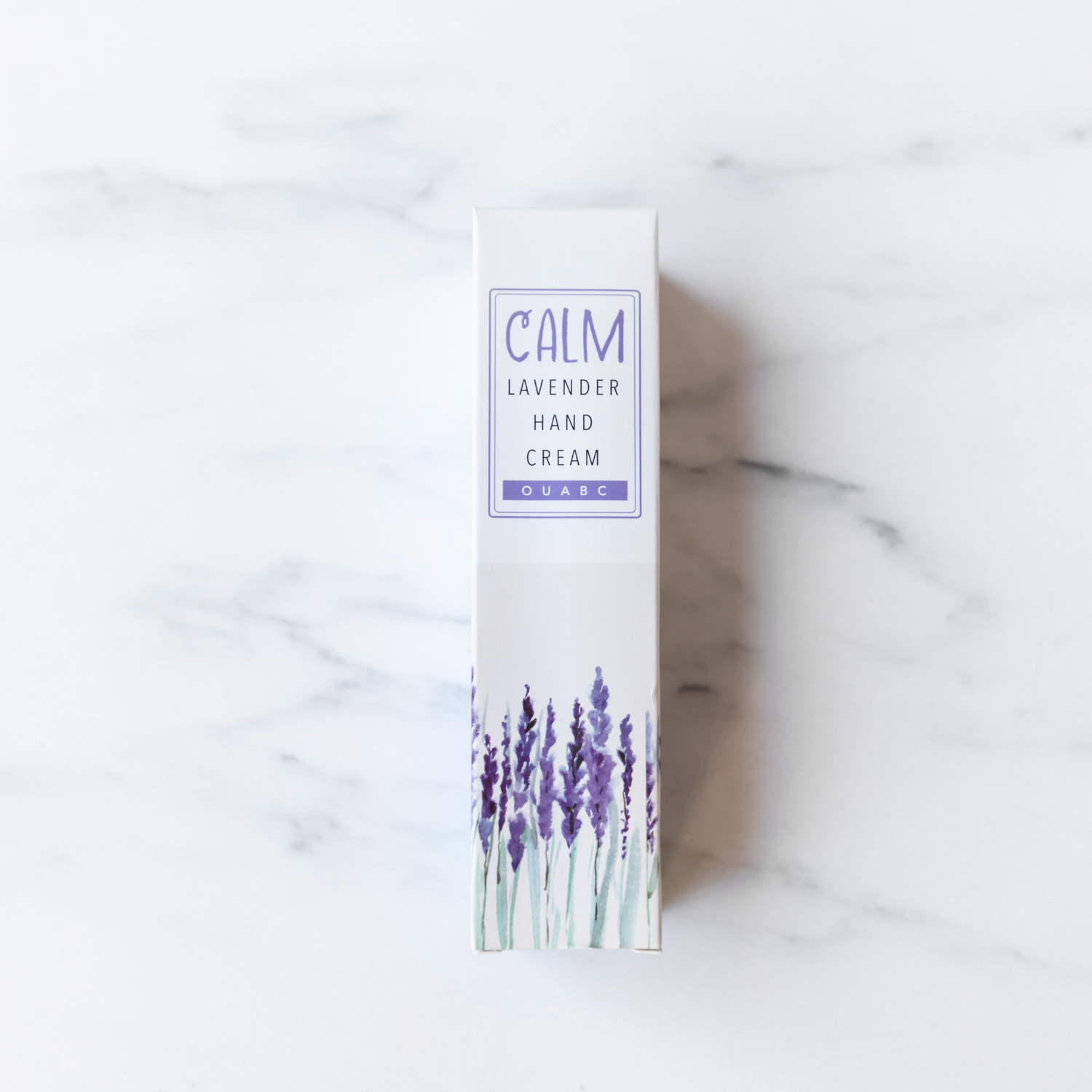 A white box with lavender on it labeled Calm Lavender Hand Cream.