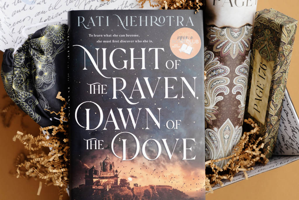 OUABC's book box 'Night of the Raven, Dawn of the Dove' book with a scarf.