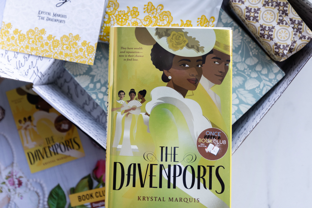 OUABC's 'The Davenports' book with decorative wrapping paper.