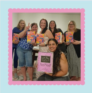 Women of different ages are holding the "Through Thick and Thin" box by Once Upon a Book Club.