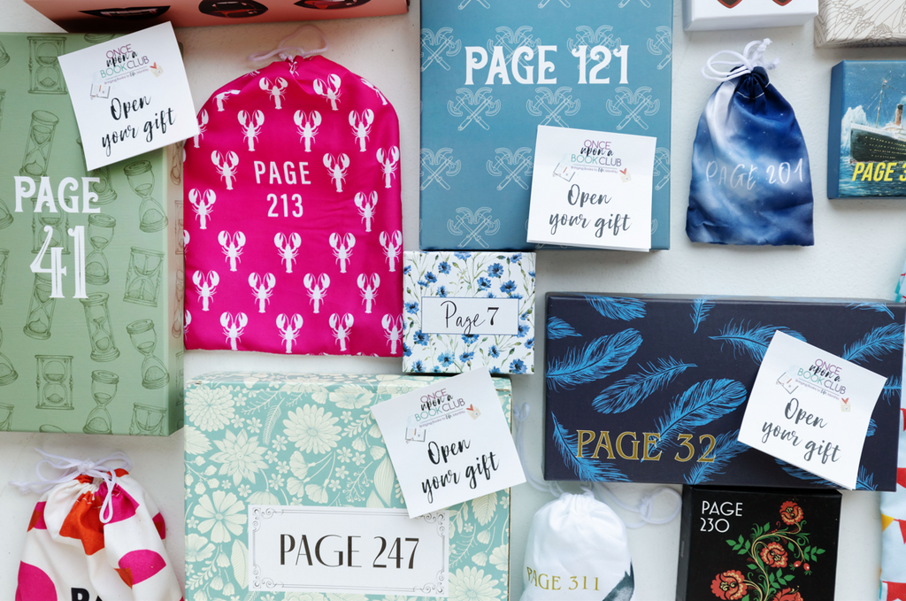 A collection of themed gifts from "Once Upon a Book Club", each with a specific page number, encouraging readers to open them at certain points in the book for a unique and immersive literary experience.