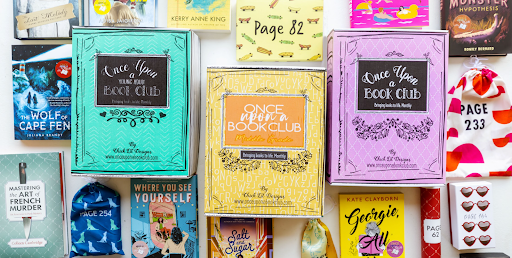 A colorful array of Once Upon a Book Club boxes and books with themed gifts, showcasing a variety of genres and the unique concept of opening a gift as you reach a certain page in the book.