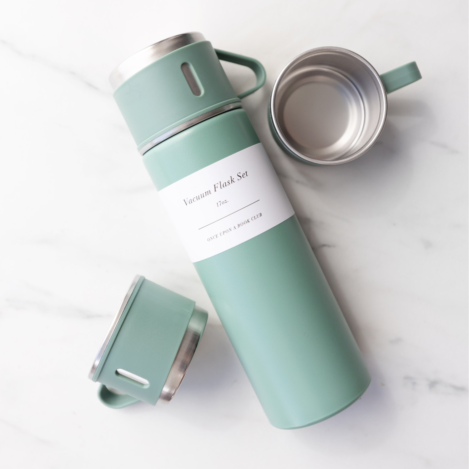 A mint green vacuum flask set with metal thermos and 3 matching cups.