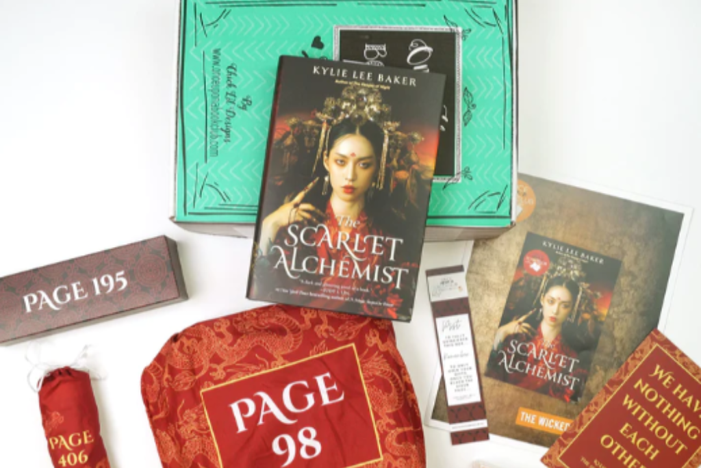 OUABC book subscription box featuring The Scarlet Alchemist by Kylie Lee Baker
