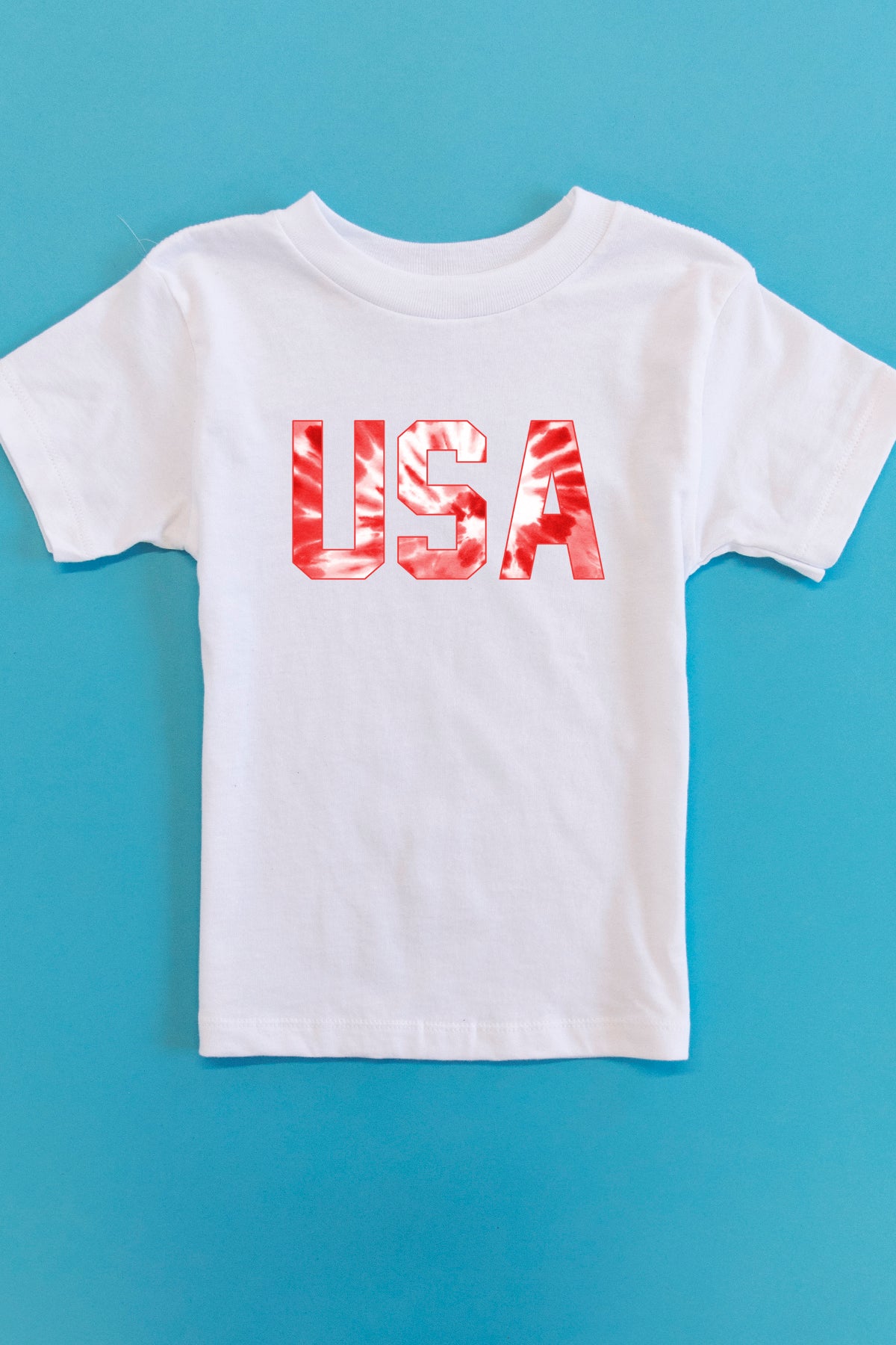 baby blue and red graphic tee