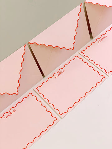 Pink and coral branded notecards and envelopes for Seraphina London